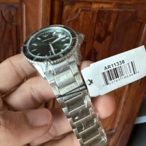 Emporio Armani AR11338 green dial diver watch with silver bracelet worn on wrist