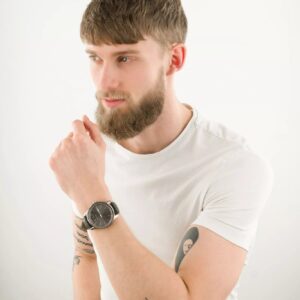 Armani Exchange Banks AX1735 watch worn on man's wrist with white t-shirt
