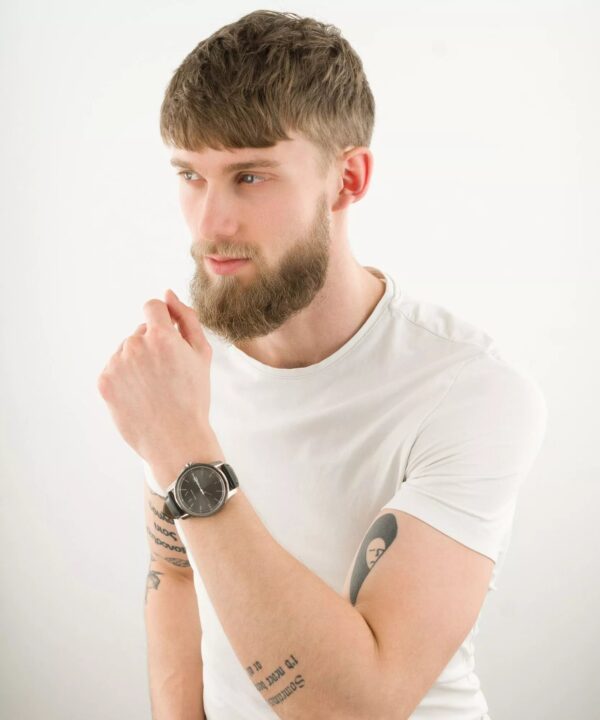 Armani Exchange Banks AX1735 watch worn on man's wrist with white t-shirt