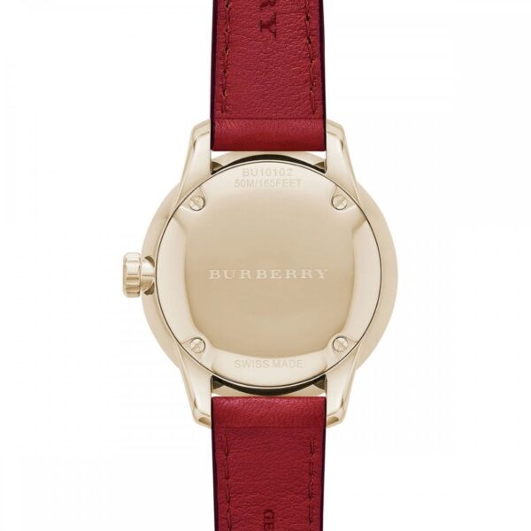 Burberry The Classic watch caseback showing gold-tone stainless steel case and burgundy leather strap