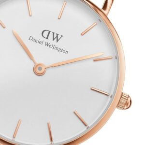 Close-up of white dial with rose gold bar indexes and Daniel Wellington branding