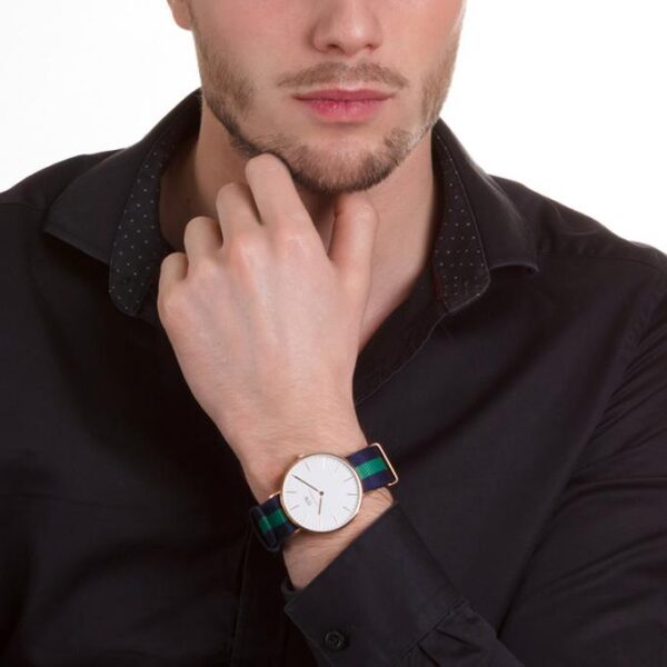 Daniel Wellington Warwick 40mm gold watch worn on wrist with white dial visible