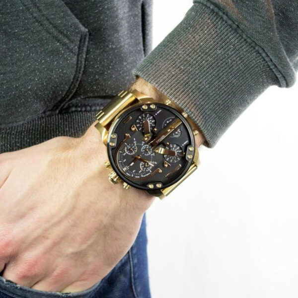 Diesel Mr. Daddy 2.0 worn on wrist showing gold case and black dial with chronograph subdials