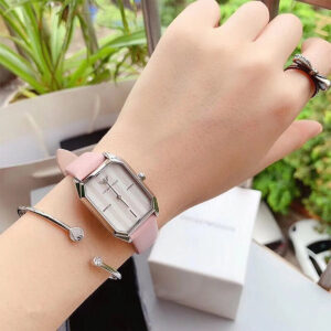 AR11207 worn on wrist with accessories, displaying rectangular case design