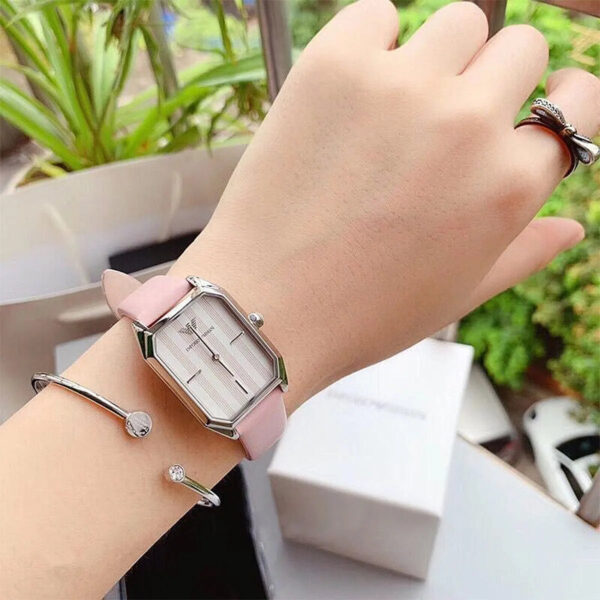 AR11207 worn on wrist with accessories, displaying rectangular case design