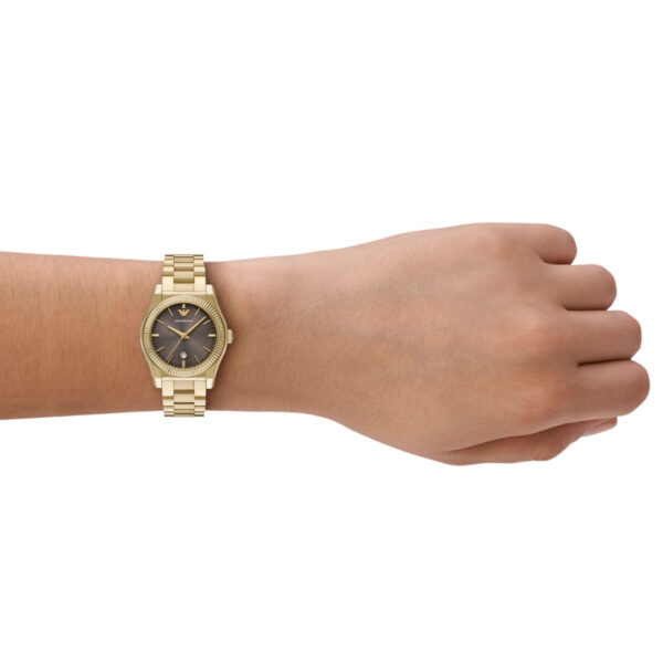 Emporio Armani AR11700 gold-tone watch worn on wrist, showing brown dial and case