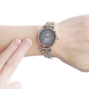 AR1725 grey dial watch worn on wrist with two-tone rose gold and silver bracelet