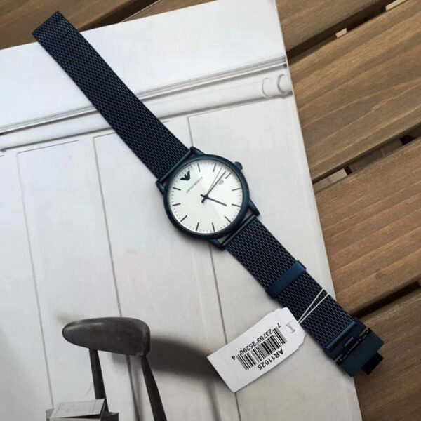 Emporio Armani Luigi watch laying flat showing white dial and blue mesh strap