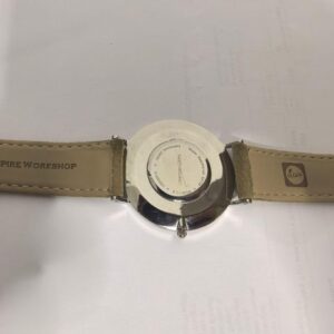 Lorenzen Dilimi watch caseback with engraved text and leather strap