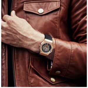 Maserati Potenza skeleton watch on wrist worn with brown leather jacket
