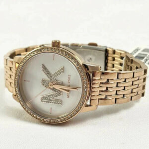 Michael Kors Adrianna II rose gold watch on wrist with crystal-studded bezel
