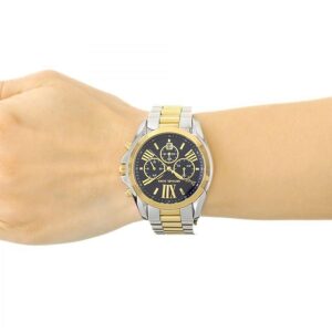Michael Kors Bradshaw chronograph watch on wrist, displaying blue dial and two-tone bracelet