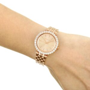 Michael Kors Darci watch worn on wrist showing rose gold dial and crystal bezel