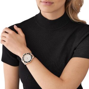 Michael Kors Everest rose gold pavé watch worn on wrist with black strap