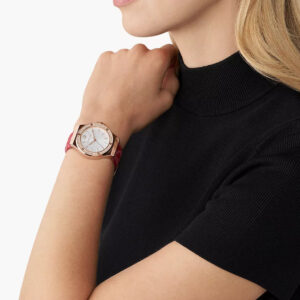 Michael Kors Lennox MK7308 watch worn on wrist, white dial with rose gold case and red leather strap