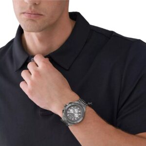 Michael Kors Lennox chronograph watch worn on wrist with dark clothing