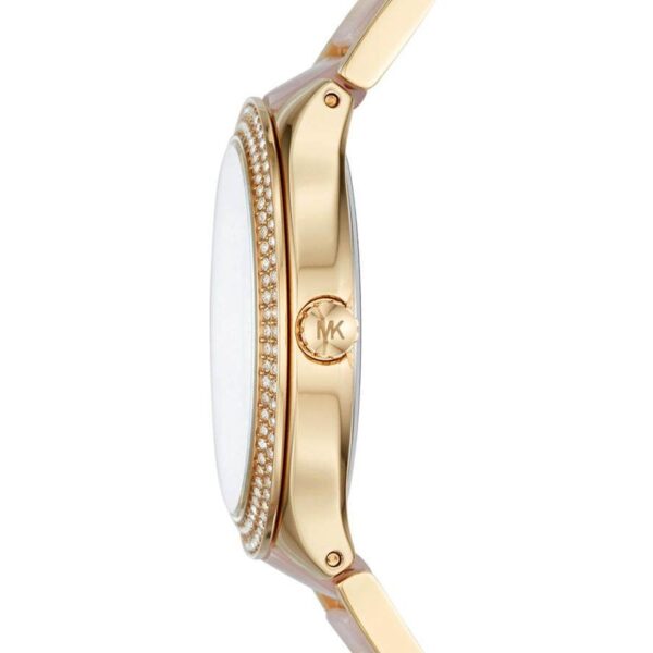 Michael Kors Kerry MK3508 side view showing gold-tone case, pink acetate strap, and crystal bezel