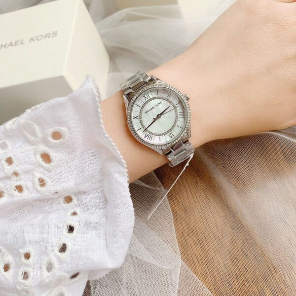 Michael Kors Lauryn watch worn on wrist with silver-tone bracelet