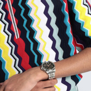 Michael Kors Brecken MK8984 oversized chronograph watch worn on wrist with striped shirt