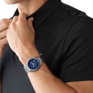 Michael Kors Slim Runway chronograph gunmetal watch worn on man's wrist