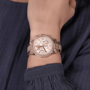 Michael Kors Ritz chronograph rose gold watch worn on wrist with rose gold bracelet