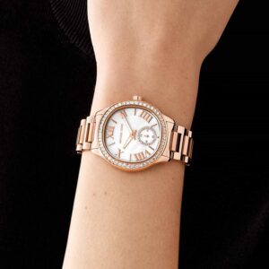 Michael Kors Sage MK4806 rose gold watch worn on wrist with white dial and crystal bezel