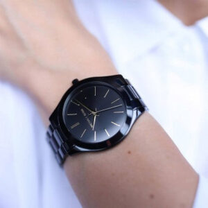 Michael Kors Slim Runway black watch on wrist displaying minimalist dial detail