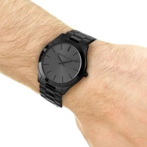 Michael Kors Slim Runway watch on men's wrist showing dial and black-tone bracelet