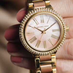Michael Kors Taryn MK6564 on-wrist view showing pink dial and crystal-set bezel