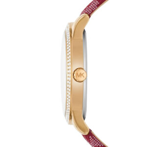 Side profile of Michael Kors Tibby watch showing crystal-set bezel, gold case, and red strap detail