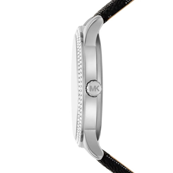 Side view of Michael Kors Tibby watch showing silver case profile with crystal-set bezel and black leather strap