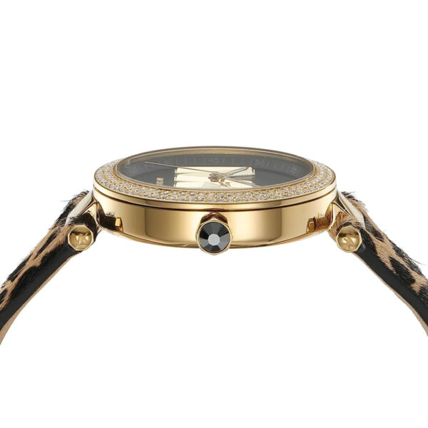 Michael Kors Parker watch dial detail showing black face, MK logo, and gold hands with pavé bezel