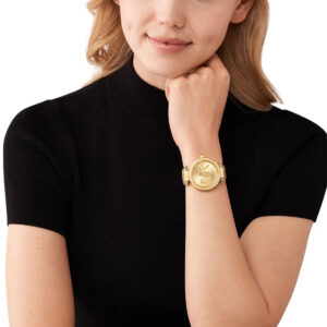 Michael Kors Parker MK4725 women's watch worn on wrist with gold-tone case and tan leather strap