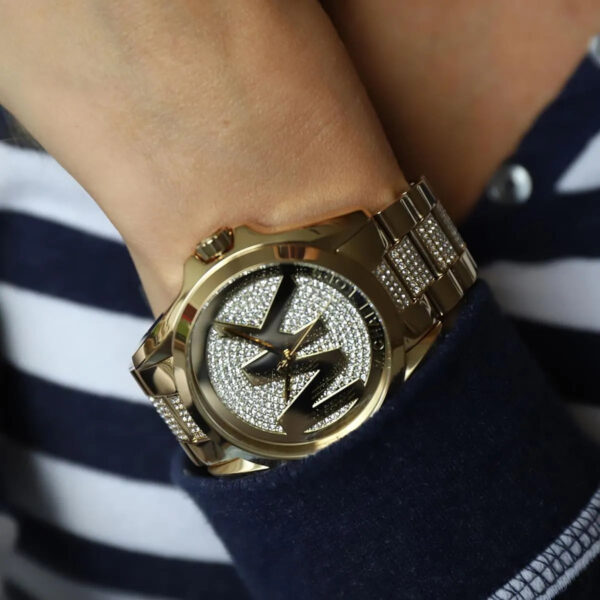 Michael Kors Bradshaw gold watch worn on wrist with crystal-paved dial