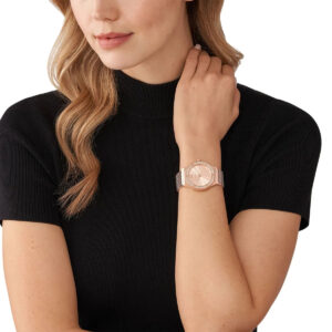 Michael Kors Lennox watch worn on wrist showing rose gold case and mesh band