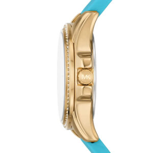 Michael Kors Mini Pilot side view showing gold-tone case profile, crystal bezel detail, and turquoise silicone strap