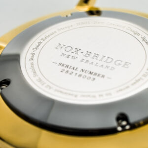 Noxbridge AG41 caseback engraved with serial number and New Zealand branding