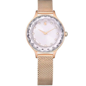 Swarovski Dextera watch front with crystal pave bezel, white dial, rose gold hands, and rose gold mesh strap