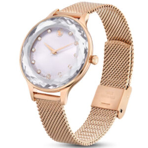 Swarovski Dextera watch on wrist showing crystal pave case, white dial with crystal hour markers, and mesh strap