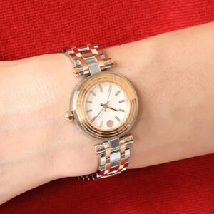 Tory Burch TBW9013 watch worn on wrist with two-tone gold and silver bracelet