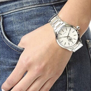 Tory Burch Collins women's watch on wrist with denim and neutral top