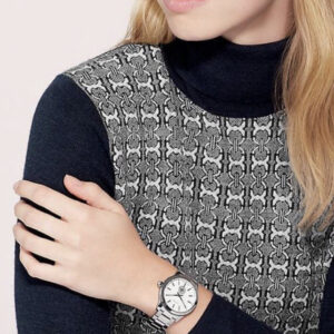 Tory Burch Collins watch worn on wrist with patterned knit top styling