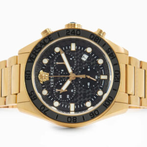 Versace Greca Dome chronograph watch with black dial and gold case, flat top-down view